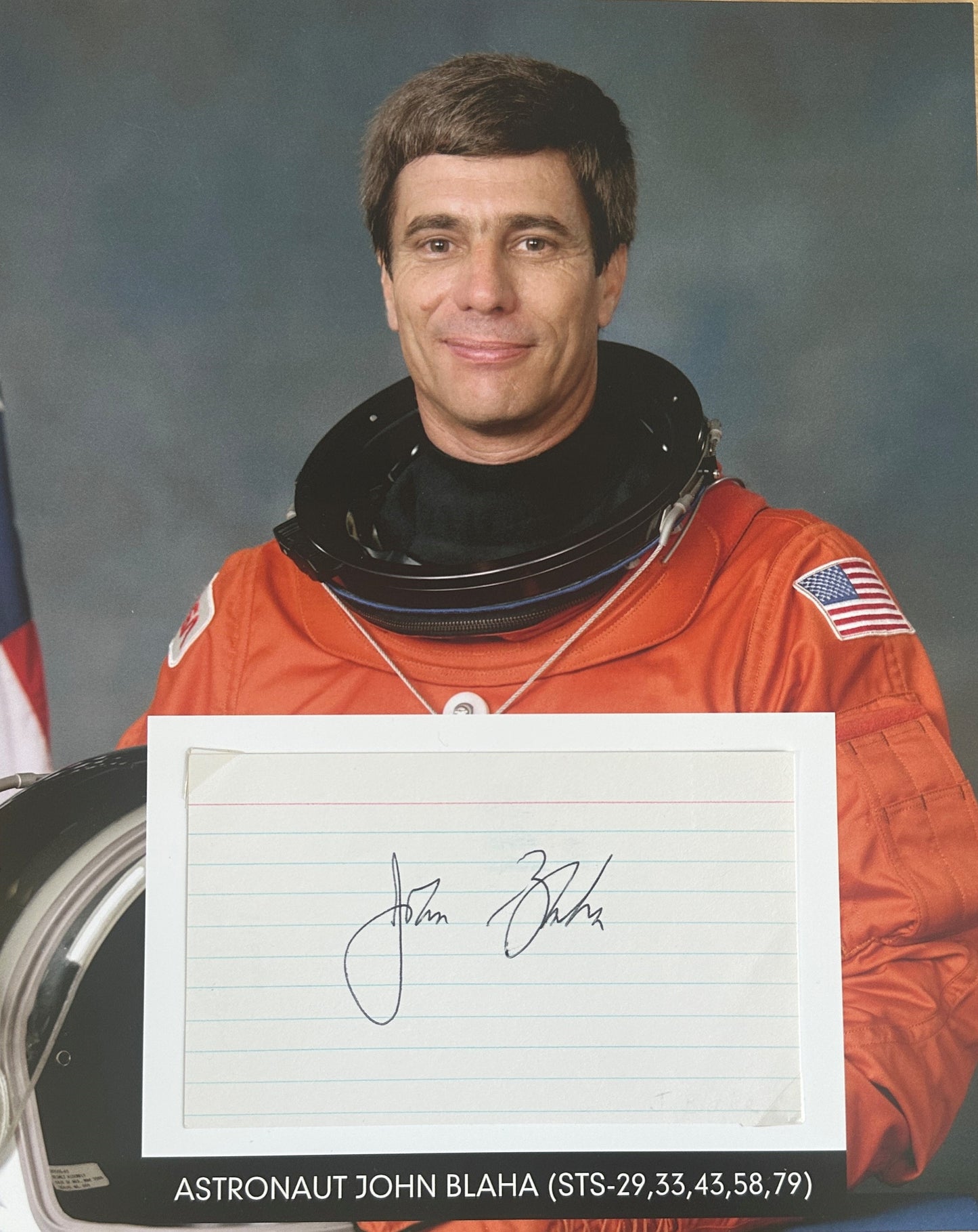 Astronaut John Blaha hand-signed 5x3'' index card on 8x10'' presentation